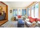 Bright sunroom with tile floors and many windows at 148 Lakeside Dr, Peachtree City, GA 30269