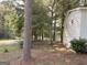 Exterior view of the side of the house featuring mature trees at 10103 Allen Sw Dr, Covington, GA 30014