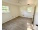 Vacant bedroom features wood-look floors and a bright, sunlit atmosphere at 10103 Allen Sw Dr, Covington, GA 30014