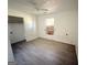 This is a bedroom with light-colored wood-look floors and a ceiling fan at 10103 Allen Sw Dr, Covington, GA 30014