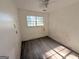 Empty bedroom featuring wood-look floors and a window for natural light at 10103 Allen Sw Dr, Covington, GA 30014