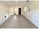 Spacious bedroom with damaged flooring, two windows, and a ceiling fan awaits your personal touch at 10103 Allen Sw Dr, Covington, GA 30014