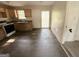 A traditional kitchen with wood cabinets and dated appliances and damaged flooring needs renovation at 10103 Allen Sw Dr, Covington, GA 30014