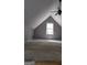Finished attic with gray walls, carpet, ceiling fan, and window at 1448 Se Hillside Place, Conyers, GA 30094