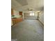 Expansive basement featuring a vintage-style ceiling fan and plenty of natural light at 1448 Se Hillside Place, Conyers, GA 30094