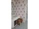 Bathroom with vanity, floral wallpaper, and tile flooring at 1448 Se Hillside Place, Conyers, GA 30094