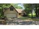 Charming home featuring an attached garage, mature trees and front yard at 1448 Se Hillside Place, Conyers, GA 30094