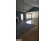 Living room featuring ceiling fan, light and access to a window filled room at 1448 Se Hillside Place, Conyers, GA 30094