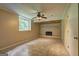 Cozy basement includes a stone fireplace and ample room for customizable living space at 3681 Chestnut Lake Ct, Jonesboro, GA 30236