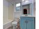 Bathroom featuring vanity, toilet, bathtub, and mirror with modern lighting at 3681 Chestnut Lake Ct, Jonesboro, GA 30236
