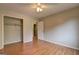 Bedroom with hardwood floors, closet, neutral walls, and natural light at 3681 Chestnut Lake Ct, Jonesboro, GA 30236