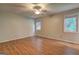 Bright bedroom featuring hardwood floors and two windows at 3681 Chestnut Lake Ct, Jonesboro, GA 30236