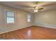 Light-filled bedroom features hardwood floors and two windows that offer plenty of natural light at 3681 Chestnut Lake Ct, Jonesboro, GA 30236