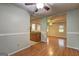 Cozy dining room with hardwood floors and open access to the kitchen at 3681 Chestnut Lake Ct, Jonesboro, GA 30236