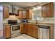 Updated kitchen features stainless steel appliances, granite countertops, and ample cabinet space at 3681 Chestnut Lake Ct, Jonesboro, GA 30236