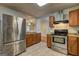 Modern kitchen with stainless steel appliances, granite countertops, tile floors, and an open layout at 3681 Chestnut Lake Ct, Jonesboro, GA 30236