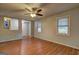 Spacious living room with hardwood floors, a ceiling fan, and views into the entryway at 3681 Chestnut Lake Ct, Jonesboro, GA 30236