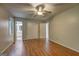 Main bedroom with hardwood floors, ceiling fan, ensuite bath, and closet at 3681 Chestnut Lake Ct, Jonesboro, GA 30236