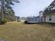 Expansive backyard featuring a deck and view of the neighborhood at 164 Turner Creek Dr, Hampton, GA 30228
