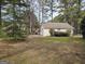 View of the detached garage/shed and expansive yard at 164 Turner Creek Dr, Hampton, GA 30228