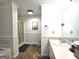 Bathroom features a shower, sink, bathtub, and pink and white decor and a walk-in shower at 164 Turner Creek Dr, Hampton, GA 30228