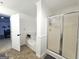 Bathroom with a walk-in shower, bathtub, and white trim for a clean and elegant look at 164 Turner Creek Dr, Hampton, GA 30228