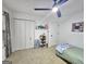 Bright bedroom featuring carpet, closet, ceiling fan and fun decor for a or teenager at 164 Turner Creek Dr, Hampton, GA 30228