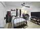 Neutrally decorated bedroom with carpet, closet, ceiling fan and desk offers an organized layout at 164 Turner Creek Dr, Hampton, GA 30228