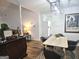 Dining room featuring modern lighting and an adjacent living area at 164 Turner Creek Dr, Hampton, GA 30228