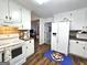 Functional kitchen with white cabinetry and modern appliances flowing into the living area at 164 Turner Creek Dr, Hampton, GA 30228