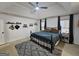 Spacious bedroom with a vaulted ceiling, ceiling fan, large bed, and soft gray rug at 164 Turner Creek Dr, Hampton, GA 30228