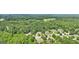 Beautiful aerial view of the neighborhood homes with lush green landscape at 320 Silverbell Ln, Sharpsburg, GA 30277