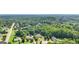 Aerial view of the community and surrounding lush green trees and foliage at 320 Silverbell Ln, Sharpsburg, GA 30277