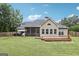 Well-maintained backyard with a wooden deck and screened-in porch, great for outdoor relaxation at 320 Silverbell Ln, Sharpsburg, GA 30277