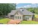 This lovely home features a charming screened in porch and wooden deck at 320 Silverbell Ln, Sharpsburg, GA 30277
