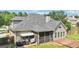 This lovely home features a charming screened in porch and deck area at 320 Silverbell Ln, Sharpsburg, GA 30277