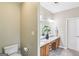 Bathroom featuring a double sink vanity with granite countertop and tiled floors at 320 Silverbell Ln, Sharpsburg, GA 30277