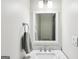 Clean bathroom with marble vanity, modern fixtures, and a well-lit mirror at 320 Silverbell Ln, Sharpsburg, GA 30277