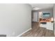 Bedroom features hardwood floors, neutral walls, closet, en-suite bathroom, and a bright window view at 320 Silverbell Ln, Sharpsburg, GA 30277