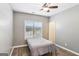 Neutral bedroom showcasing hardwood floors and a window providing plenty of natural light at 320 Silverbell Ln, Sharpsburg, GA 30277