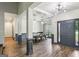 Elegant dining room features wood floors, white trim, modern lighting, and access to other rooms at 320 Silverbell Ln, Sharpsburg, GA 30277
