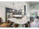 Modern kitchen features stainless steel appliances, a spacious island, and stylish pendant lights at 320 Silverbell Ln, Sharpsburg, GA 30277