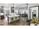 Open-concept kitchen and living room with a large island and bar stool seating at 320 Silverbell Ln, Sharpsburg, GA 30277