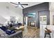 Living room showcases a modern fireplace, sleek ceiling fan, and comfortable seating at 320 Silverbell Ln, Sharpsburg, GA 30277
