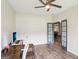 Home office with wood floors and a doorway leading to the living room at 320 Silverbell Ln, Sharpsburg, GA 30277
