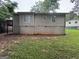 Spacious backyard with green grass and a wood deck at 9107 Morris Sw Dr, Covington, GA 30014