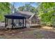 Backyard features a deck with a gazebo, perfect for outdoor living and entertaining at 425 Birkdale Dr, Fayetteville, GA 30215