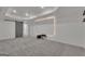 Spacious basement media room with a large screen, recessed lighting, and a barn door at 425 Birkdale Dr, Fayetteville, GA 30215