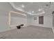 Basement media room with a large projection screen, projector, recessed lights, and modern finishes at 425 Birkdale Dr, Fayetteville, GA 30215