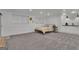 Finished basement featuring a bed, bright windows, and cozy kitchenette at 425 Birkdale Dr, Fayetteville, GA 30215